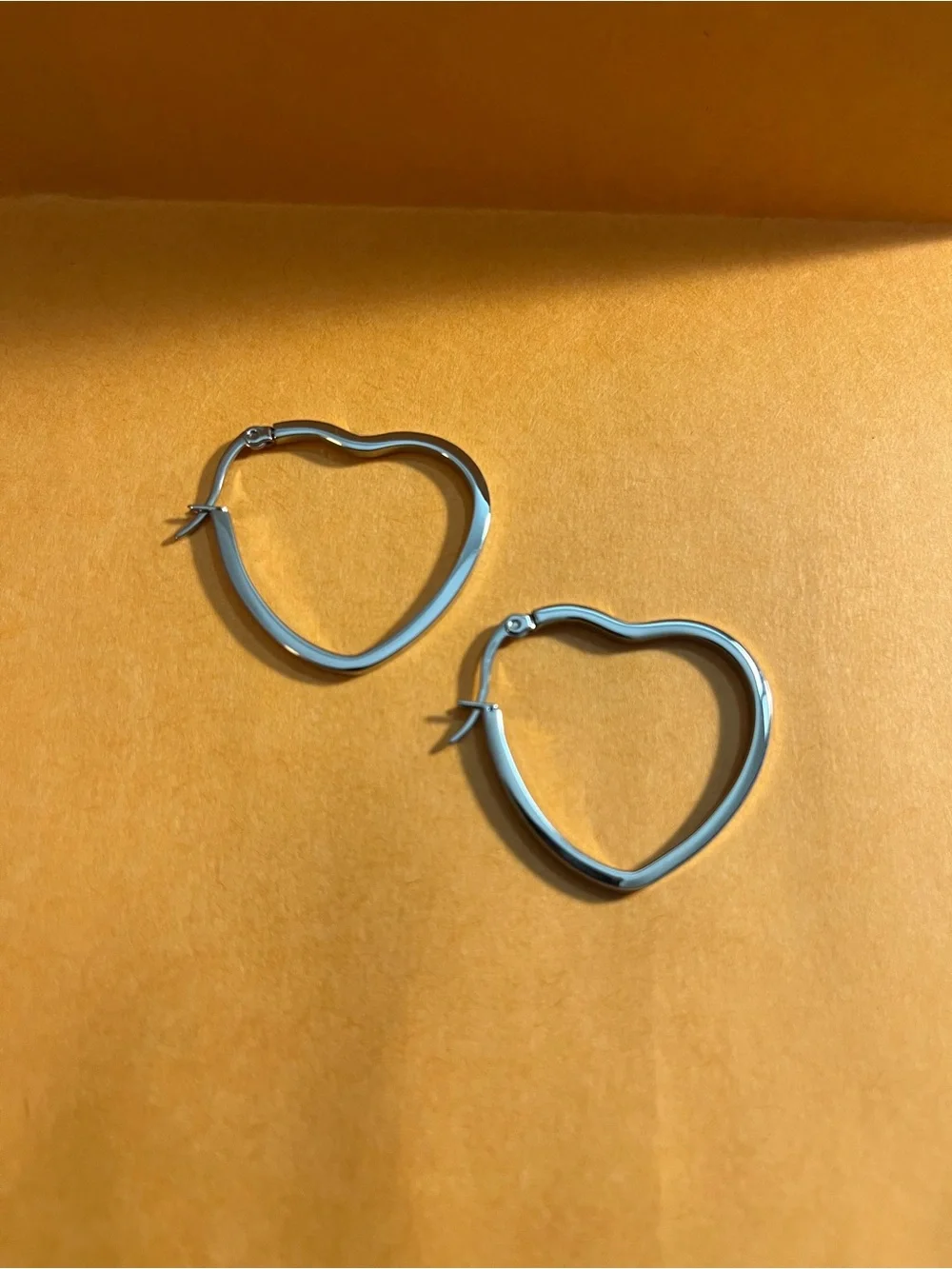 Stately Steel Heart-Shaped Hoop Earrings - Women's Jewelry easy on and off.